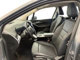 the interior of a car with the door open and the driver ' s seat up