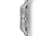 the back of a watch on a white surface with a white background