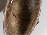 a brown vase that is sitting on a white table
