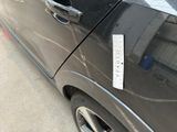 a car with a sticker on the side of it ' s door