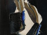 a painting of a pair of shoes on a table