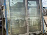 an image of a large window on a pallet in a parking lot
