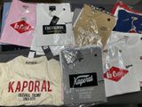 a lot of t - shirts that are on a table