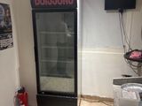 an image of a room with a refrigerator in it