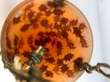 an image of a lamp with a flower design on it