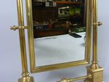 a mirror that is sitting on a stand on a table