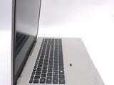 a close up of a laptop computer on a white surface