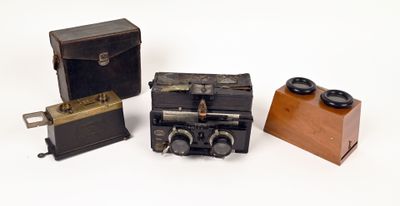 three different types of antique cameras on a white surface