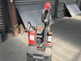 a machine that is sitting on the ground in front of a building