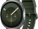 a smart watch with a green band on the wrist