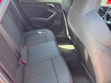 two seats in the back of a red car