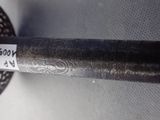 a close up of a metal object with a tag on it