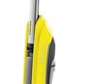 a yellow vacuum cleaner with a black handle and a black and white mop