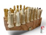 a chess board with a lot of chess pieces on it
