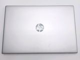 a laptop that is sitting on a white table