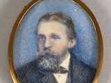 portrait of a man with a beard in a suit and bow tie