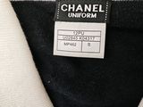 chanel uniform label on a black and white sweater