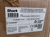 a box with a sticker on it that says shark