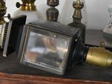 many different types of antique lamps on a table