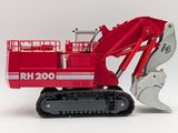 a toy excavator that is sitting on a white surface
