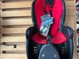 a picture of a child ' s car seat hanging on a wall