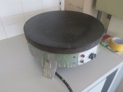 a pan sitting on top of a stove in a kitchen