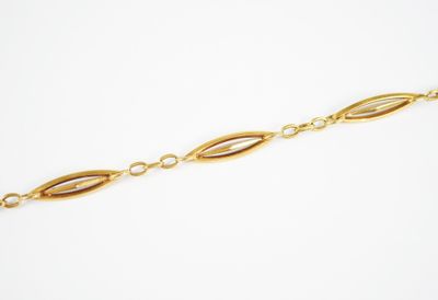 a close up of a gold chain on a white background