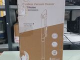 packaging of a vacuum cleaner sitting on a table in a room