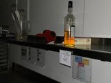 a bottle of alcohol sitting on a counter in a kitchen
