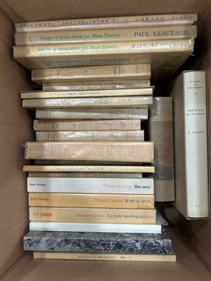 a box full of books that are stacked on top of each other