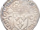 a close up of a coin with a coat of arms on it