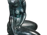 statue of a woman sitting on her knees with her hands on her knees
