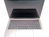 a close up of a laptop computer on a white surface