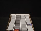 a box with a bunch of video game controllers inside of it