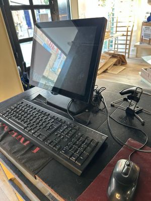 a computer on a desk with a mouse and keyboard