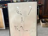 a picture of a drawing on a easel in a room
