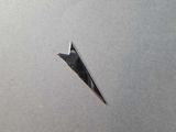 a paper airplane that is flying in the sky