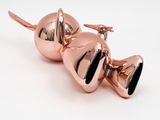 two shiny bells sitting on top of each other