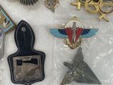 some of the badges have been placed on a white surface