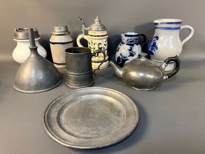 a lot of silver and silverware on a table