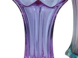 two vases that are sitting side by side on a white background