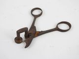 an old pair of scissors on a white surface