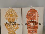 two boxes with stamps on them sitting next to each other