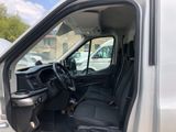 the interior of a white van with the driver ' s seat up