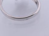 an image of a diamond ring on a white surface