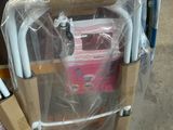 a cart full of luggage that is wrapped in plastic