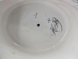 a white plate with a black writing on it