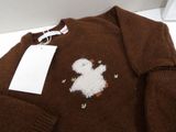 a brown sweater with a white teddy bear on it
