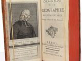 an old book with a picture of a man in a black coat