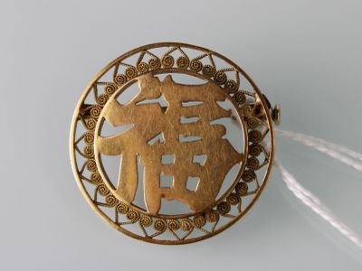 Broche de forme ronde en or jaune (18 carats) à décor d'idéo… - Photo 1